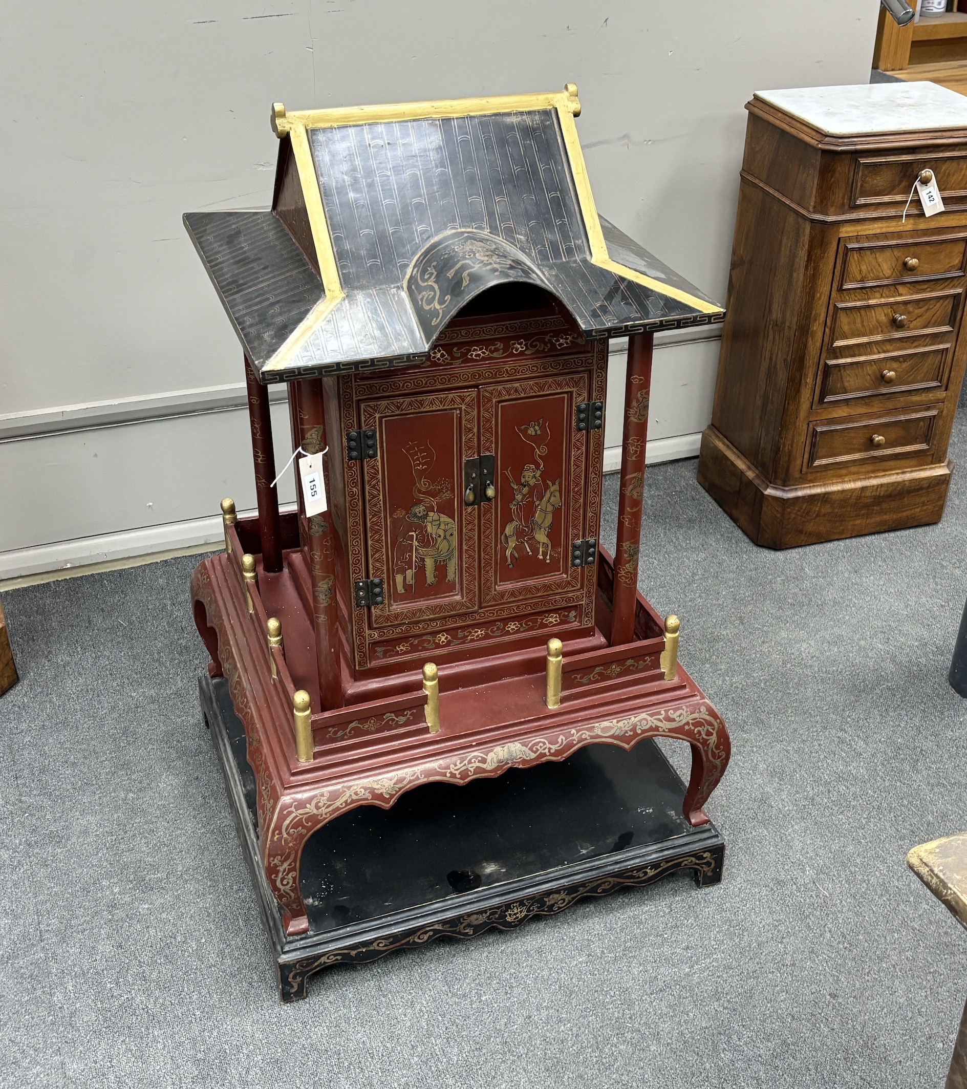 A Chinese scarlet and black lacquer temple shrine, height 112cm